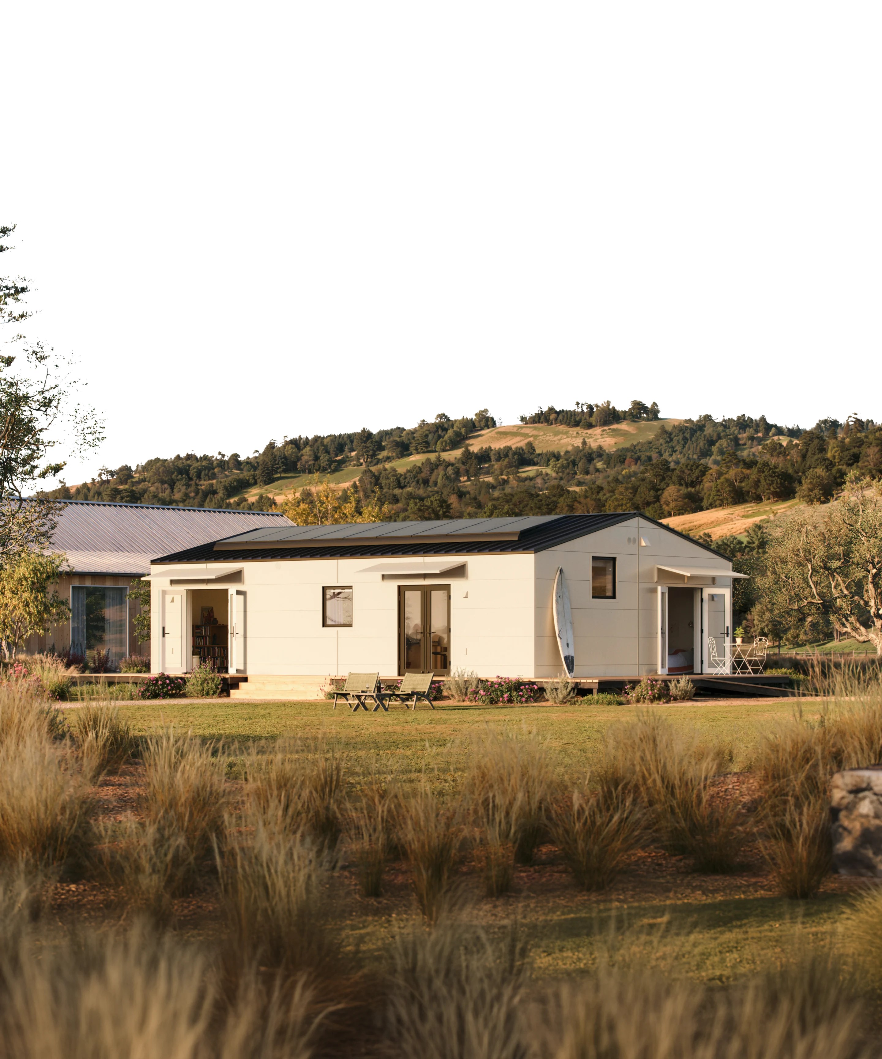 Two women sitting at a modern table talking with a city view behind them.